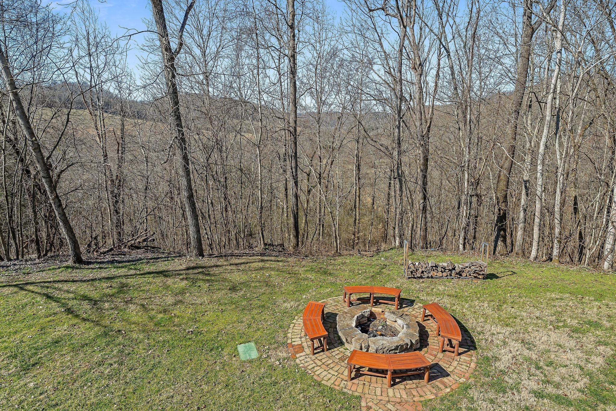 7775 Medley Amonette Road Buffalo Valley, TN 38548 - Photo 60 of 61 a backyard of a house with lots of green space and fountain