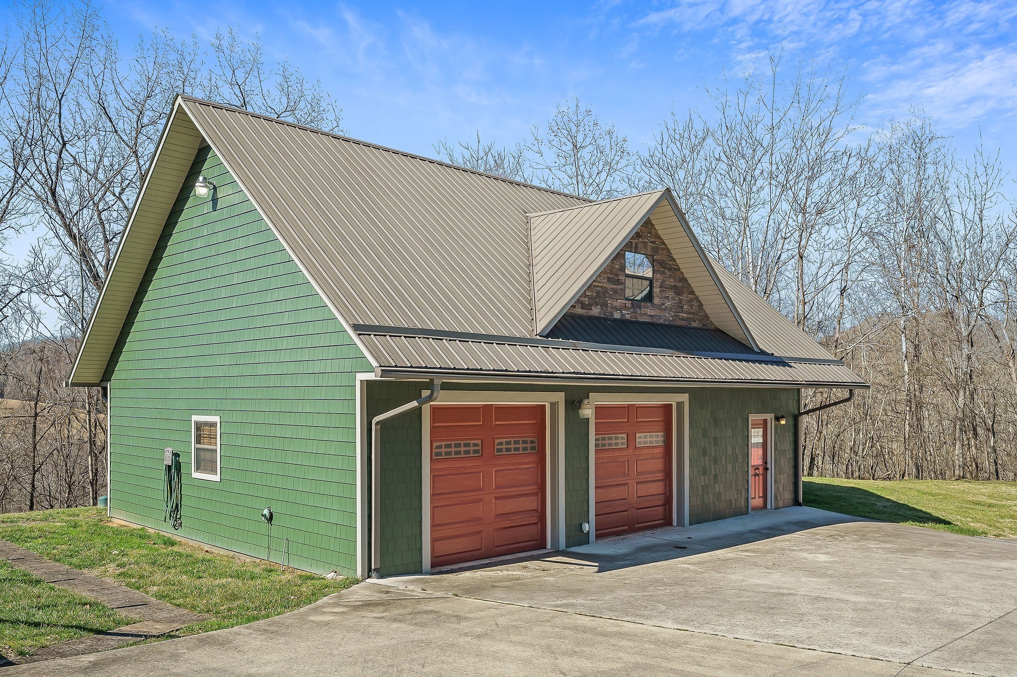 7775 Medley Amonette Road Buffalo Valley, TN 38548 - Photo 9 of 61 a front view of a house with garden