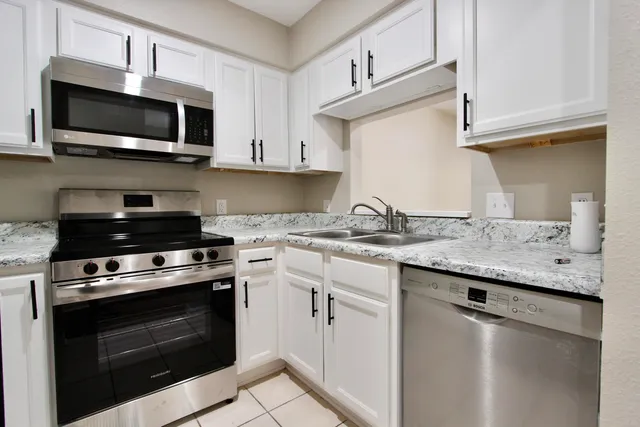 a bathroom with a sink a toilet and a bathtub