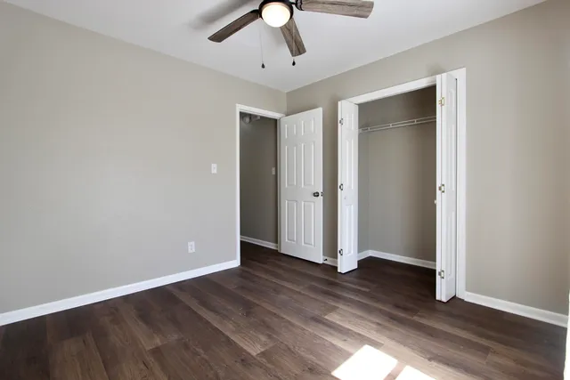 a bathroom with a toilet and shower