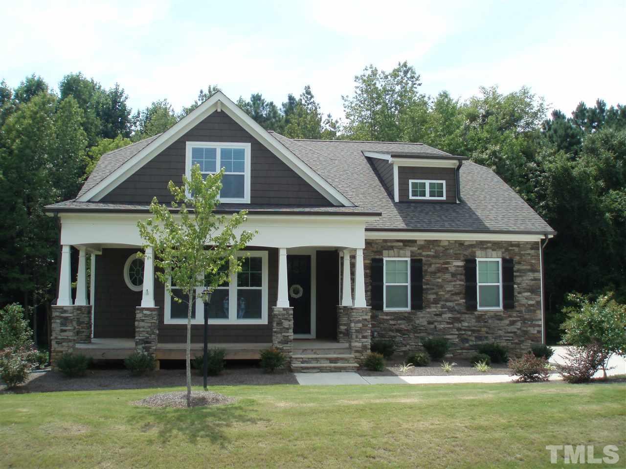 6108 Spring Branch Circle Raleigh, NC 27603 - Photo 1 of 20 a front view of a house with a yard