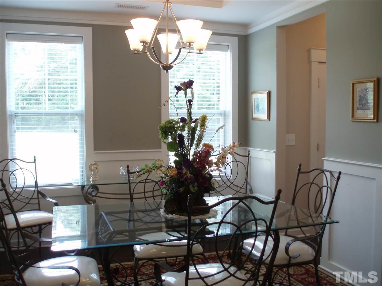 6108 Spring Branch Circle Raleigh, NC 27603 - Photo 2 of 20 a view of a dining room with furniture wooden floor and chandelier