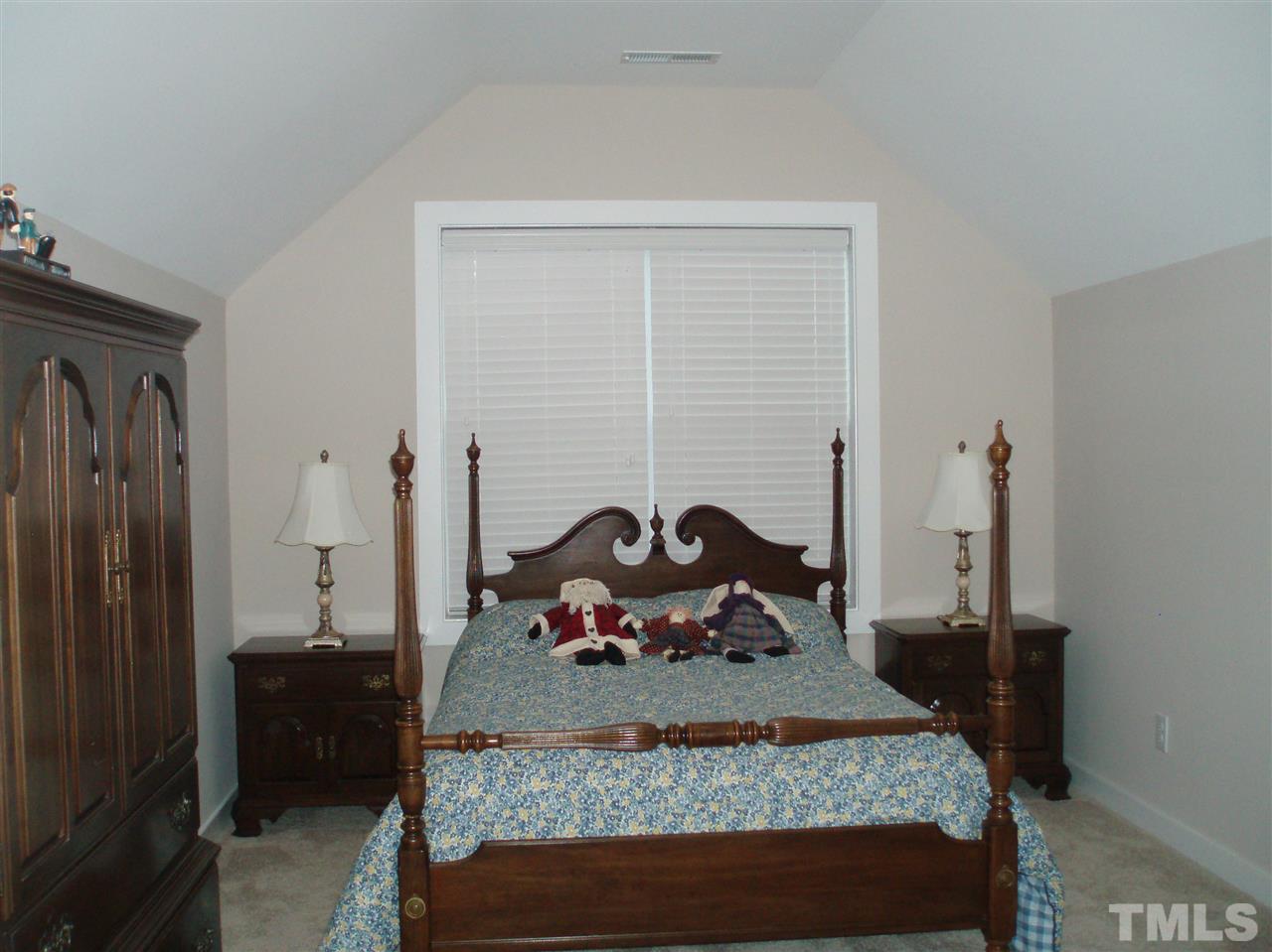 6108 Spring Branch Circle Raleigh, NC 27603 - Photo 13 of 20 a bed room with a bed and a couch