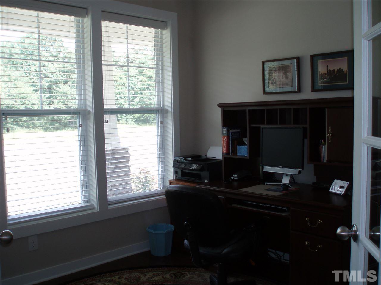 6108 Spring Branch Circle Raleigh, NC 27603 - Photo 17 of 20 a living room with furniture and a window