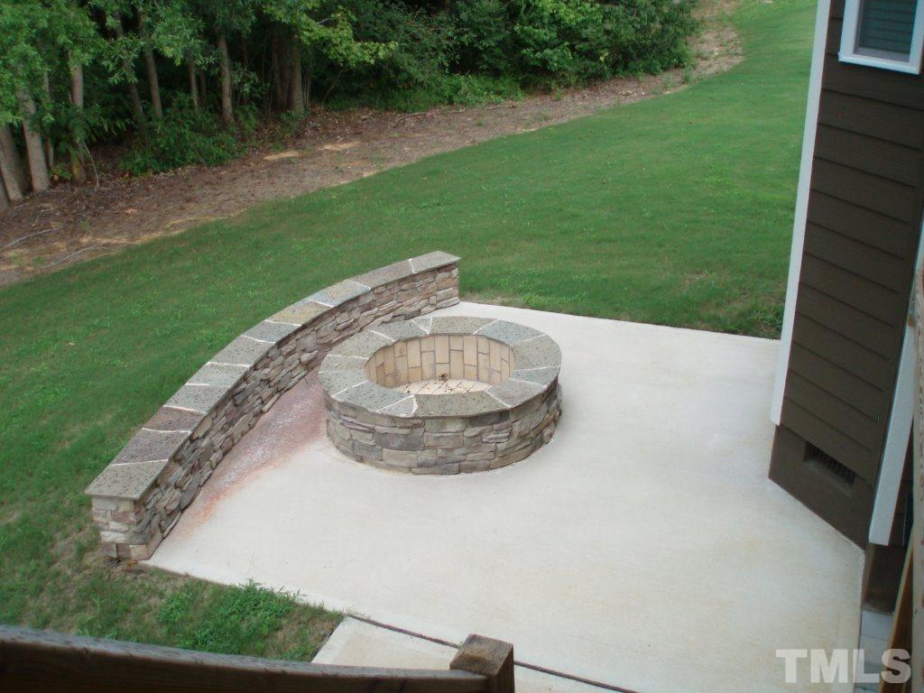 6108 Spring Branch Circle Raleigh, NC 27603 - Photo 19 of 20 a view of a tiny house with a backyard