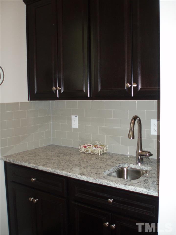 6108 Spring Branch Circle Raleigh, NC 27603 - Photo 3 of 20 a bathroom with a sink and a mirror
