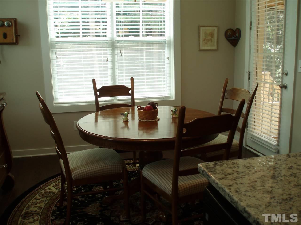 6108 Spring Branch Circle Raleigh, NC 27603 - Photo 7 of 20 a view of a dining room with furniture and window