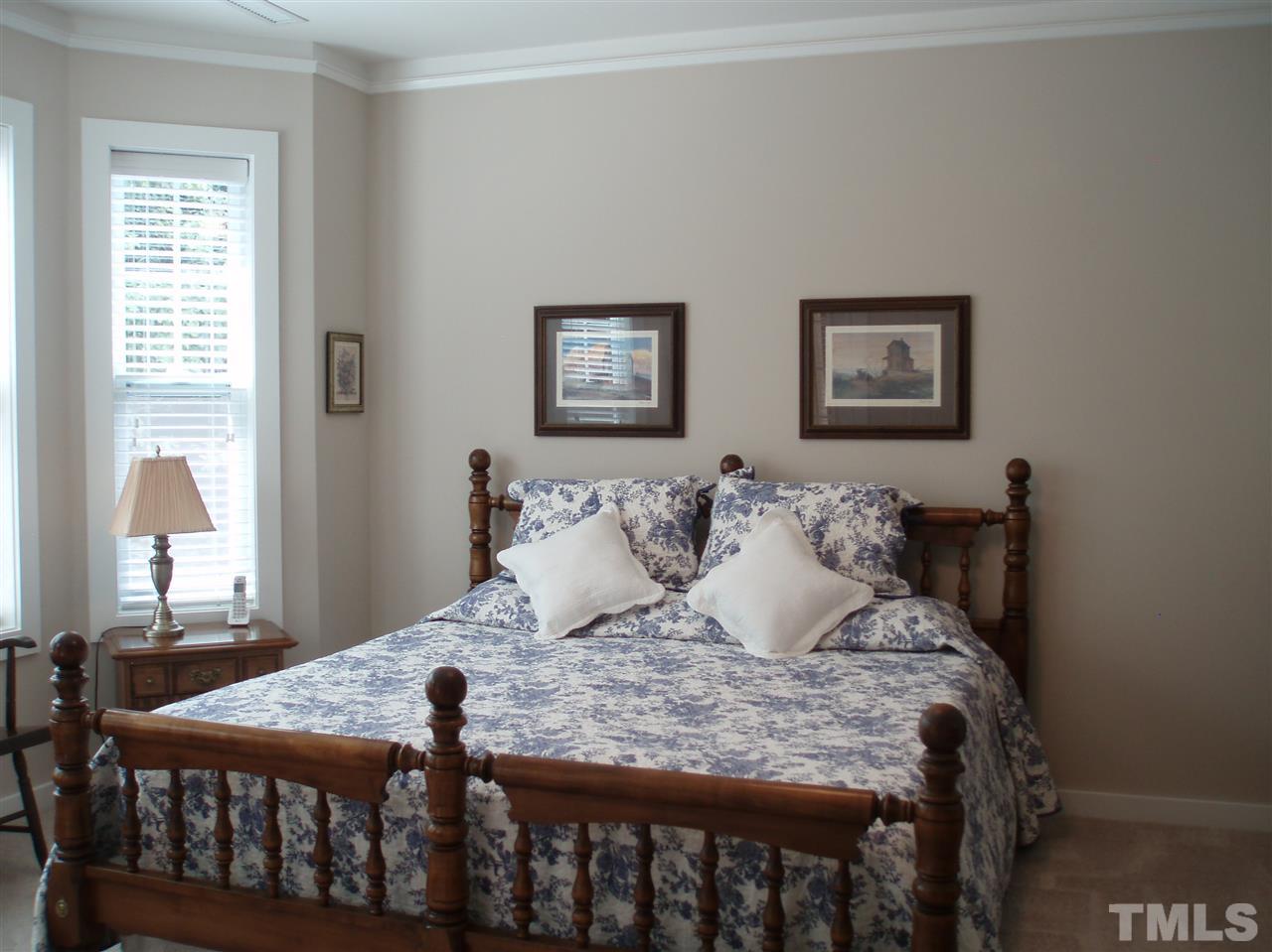 6108 Spring Branch Circle Raleigh, NC 27603 - Photo 9 of 20 a bedroom with a bed and a window