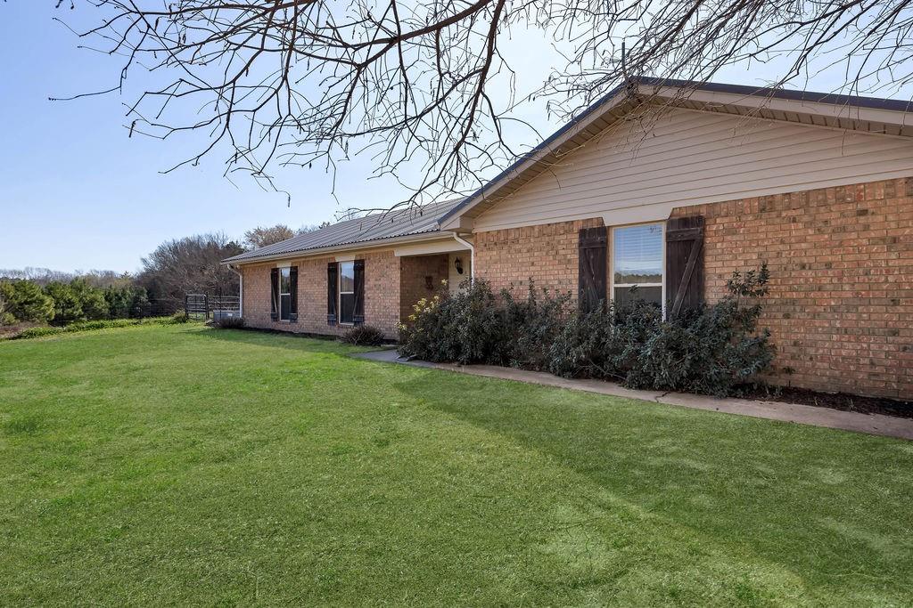 473 County Rd SE 3370 Winnsboro, TX 75494 - Photo 1 of 40 a view of a house with backyard and garden
