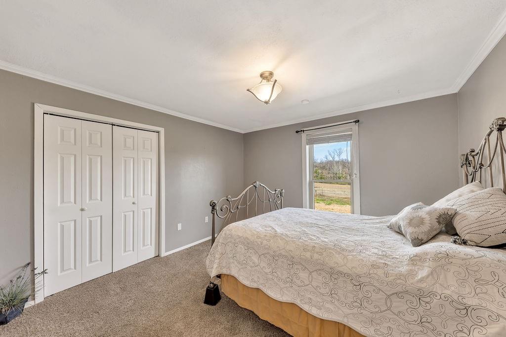 473 County Rd SE 3370 Winnsboro, TX 75494 - Photo 20 of 40 a bedroom with a bed and a window