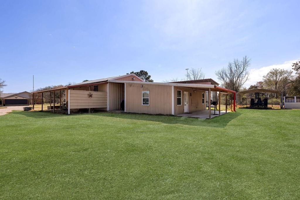 473 County Rd SE 3370 Winnsboro, TX 75494 - Photo 28 of 40 a view of a house with a big yard with large trees