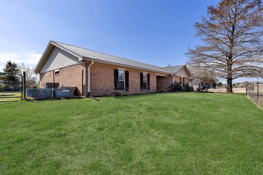 473 County Rd SE 3370 Winnsboro, TX 75494 - Photo 3 of 40 a front view of house with yard and green space