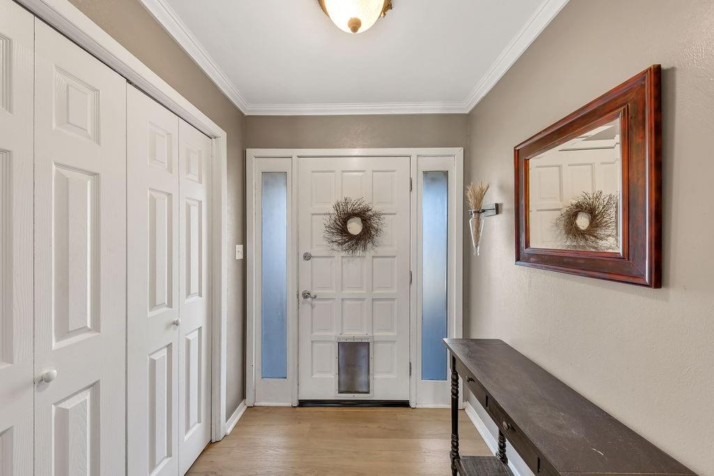 473 County Rd SE 3370 Winnsboro, TX 75494 - Photo 5 of 40 a view of a hallway with front door and wooden floor