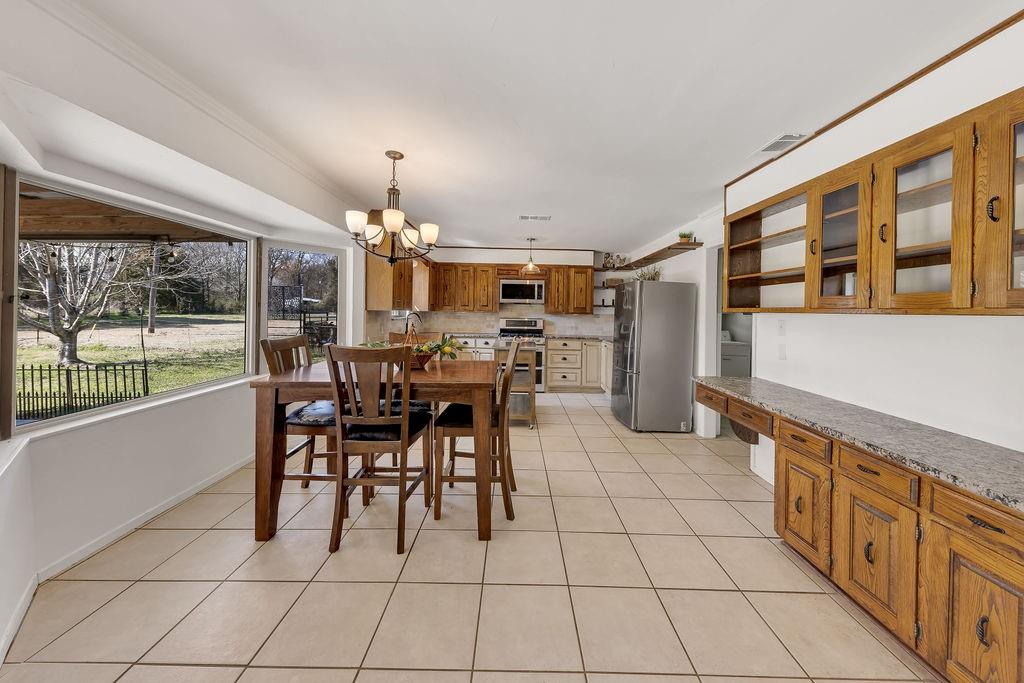 473 County Rd SE 3370 Winnsboro, TX 75494 - Photo 9 of 40 a dining space with furniture and chandelier