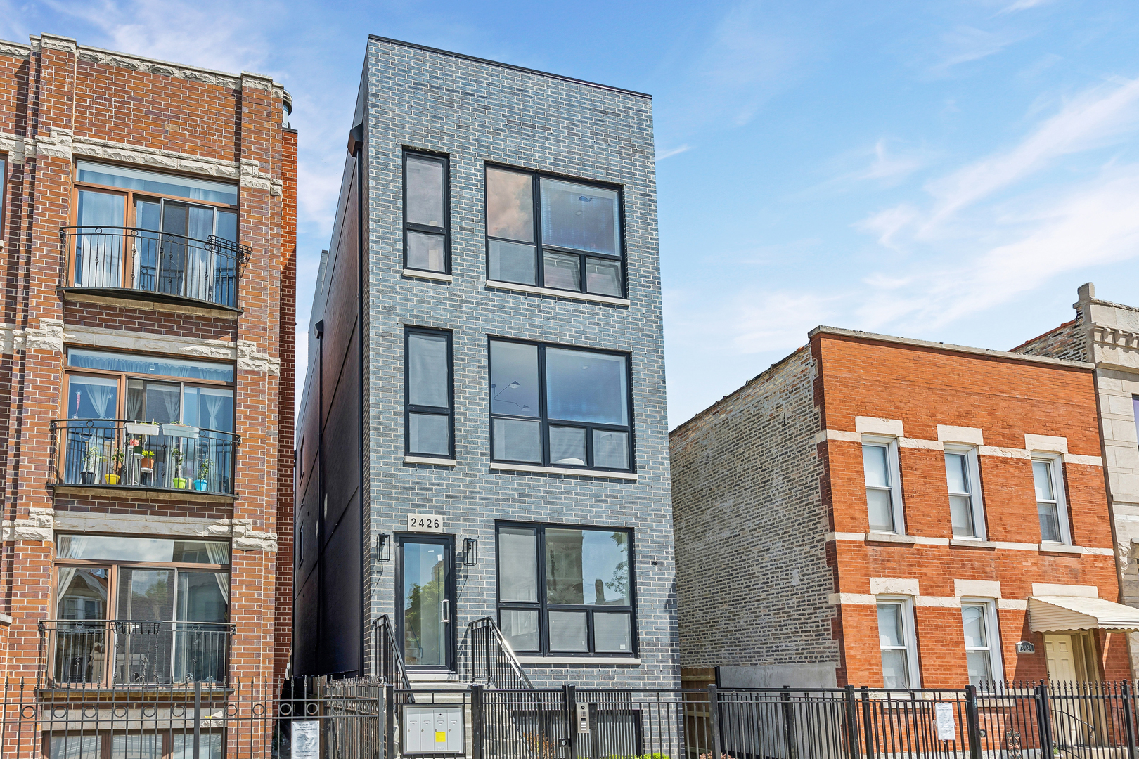 2426 West Augusta Boulevard, Unit 2 Chicago, IL 60622 - Photo 1 of 20 front view of a brick building