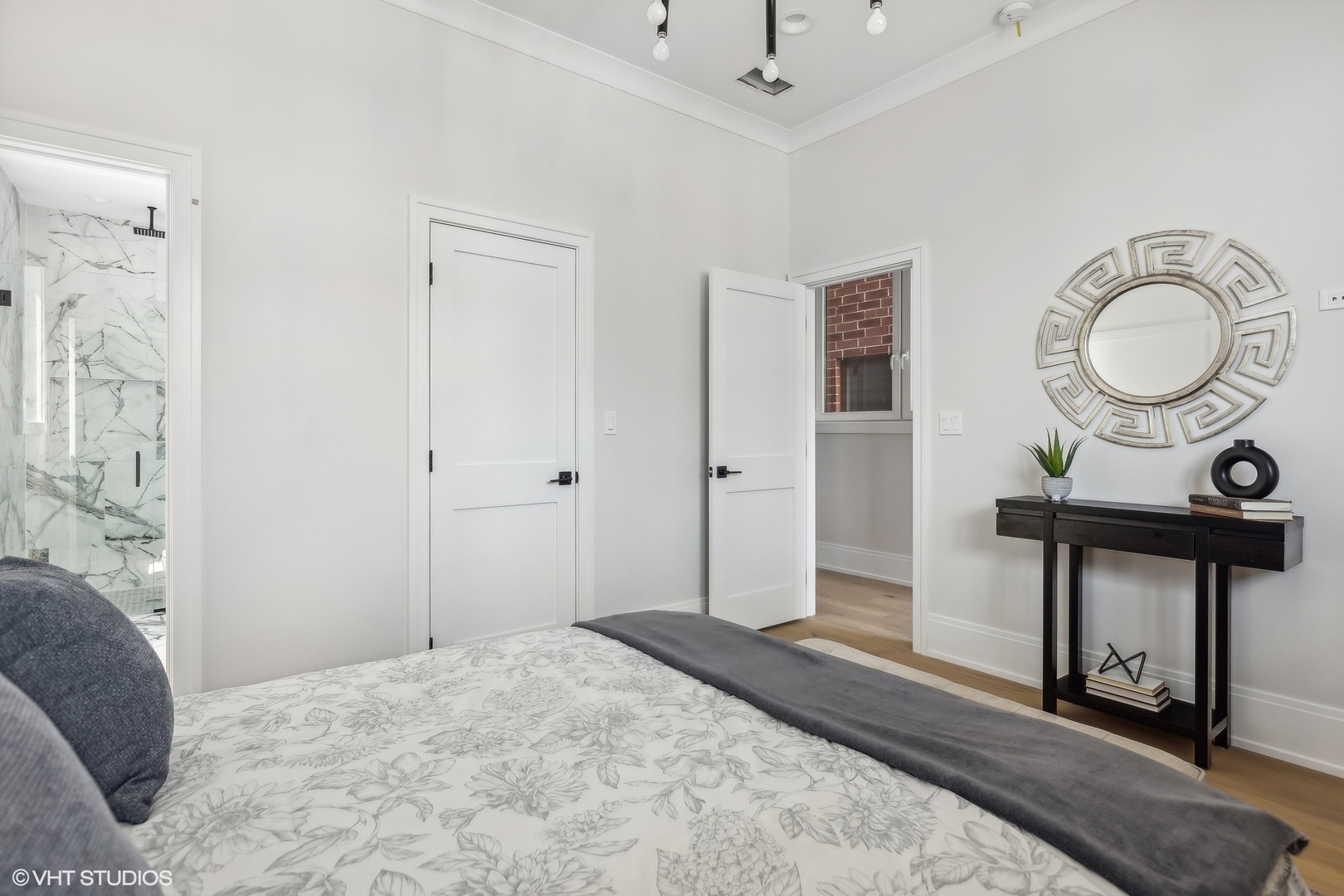 2426 West Augusta Boulevard, Unit 2 Chicago, IL 60622 - Photo 15 of 20 a view of a bedroom with a bed and wooden floor