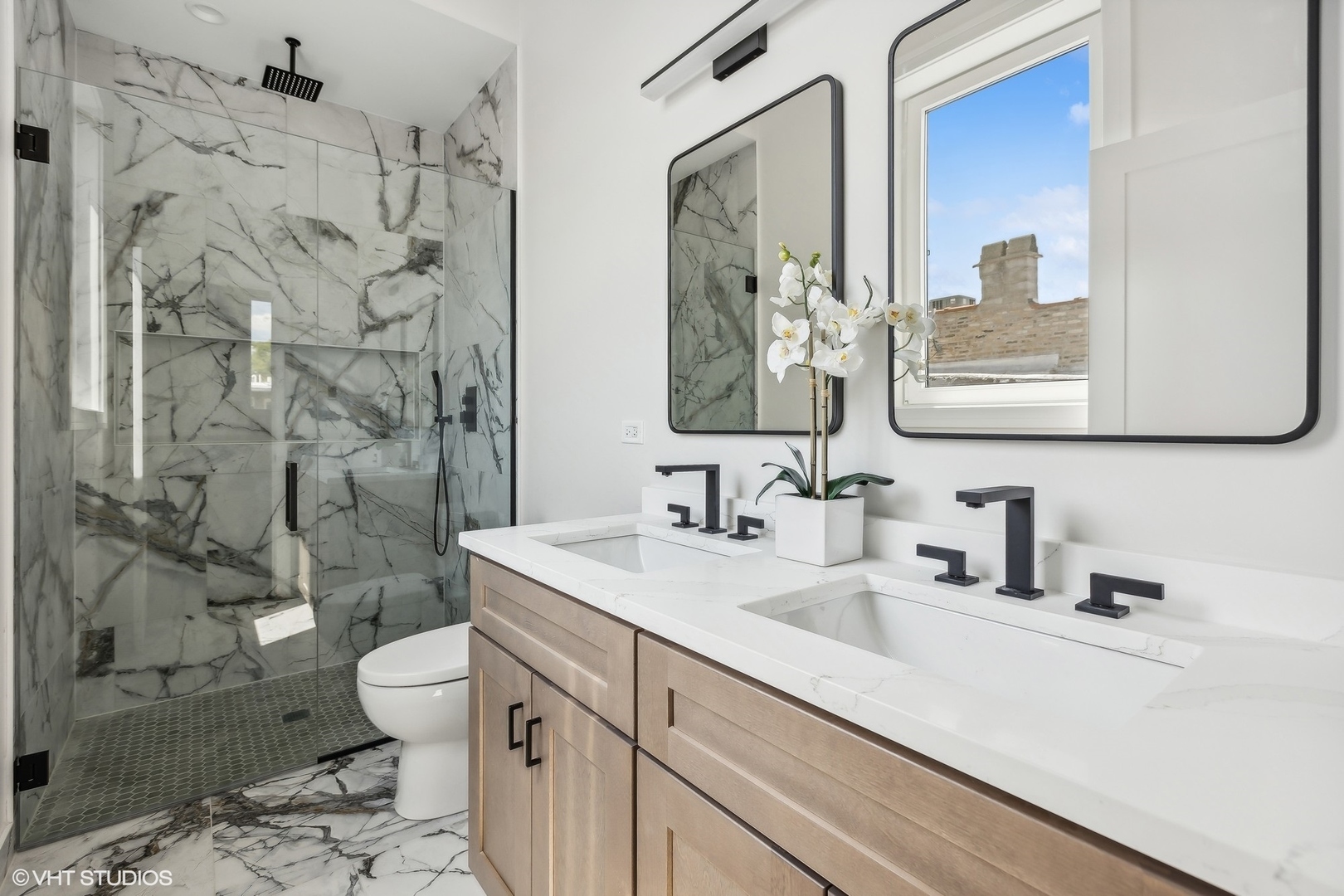 2426 West Augusta Boulevard, Unit 2 Chicago, IL 60622 - Photo 16 of 20 a bathroom with a sink a toilet and shower