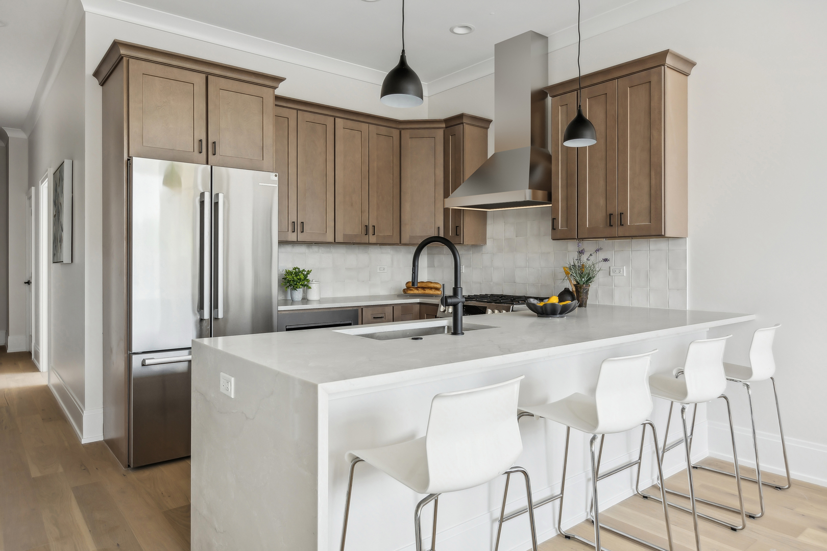 2426 West Augusta Boulevard, Unit 2 Chicago, IL 60622 - Photo 8 of 20 a kitchen with stainless steel appliances a sink stove and refrigerator