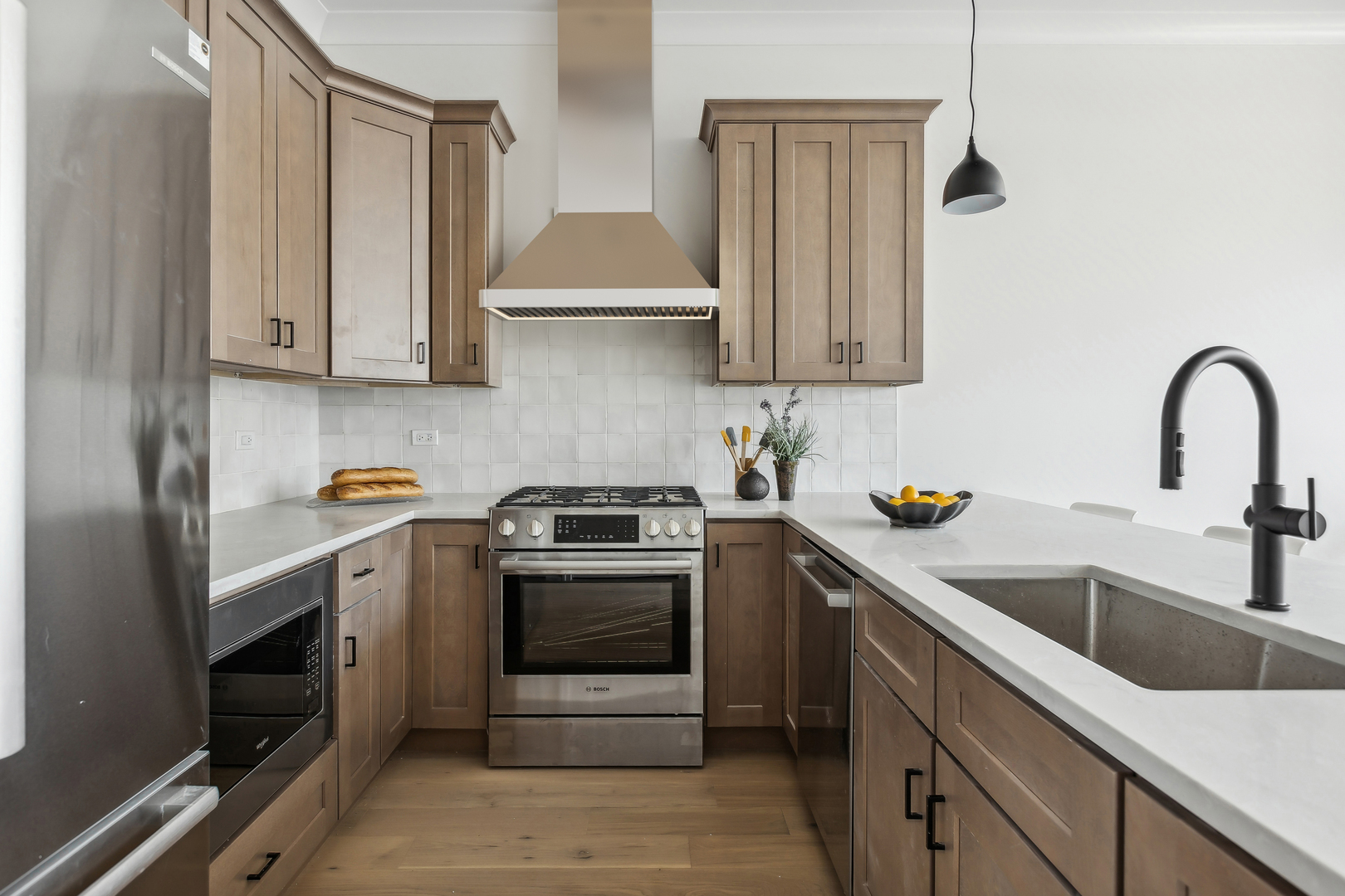 2426 West Augusta Boulevard, Unit 2 Chicago, IL 60622 - Photo 10 of 20 a kitchen with stainless steel appliances granite countertop a sink stove and cabinets