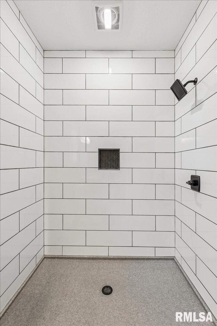 1323 5th Avenue De Witt, IA 52742 - Photo 17 of 28 a bathroom with a shower