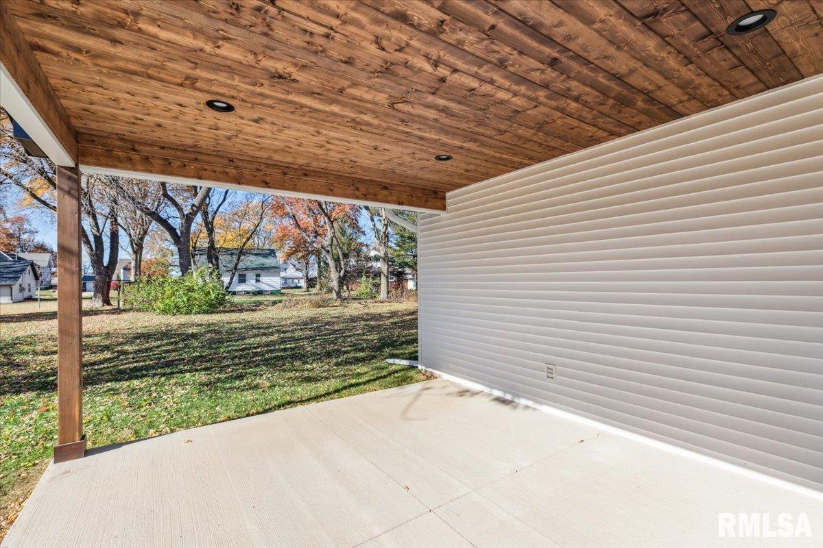 1323 5th Avenue De Witt, IA 52742 - Photo 26 of 28 a view of a backyard with a large tree