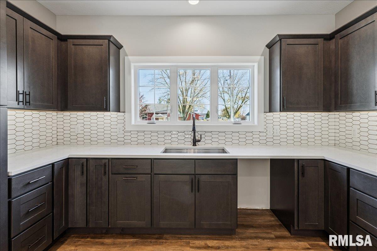 1323 5th Avenue De Witt, IA 52742 - Photo 9 of 28 a bathroom with a sink and a mirror