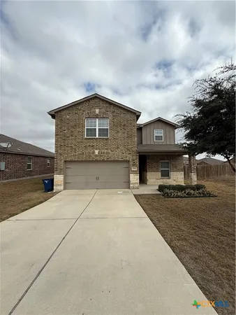 a front view of a house with yard