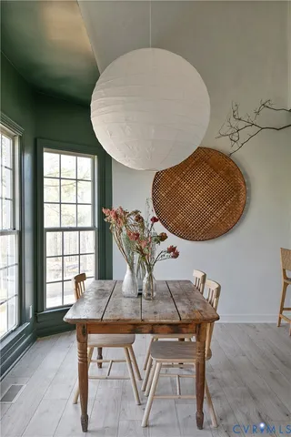 a view of a dining room with furniture and window