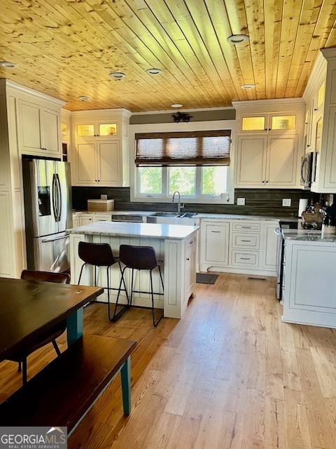 135 Horseshoe Trail Commerce, GA 30529 - Photo 11 of 25 a kitchen with stainless steel appliances granite countertop a stove a sink dishwasher a microwave oven with granite countertops and cabinets