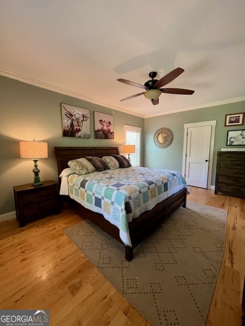 135 Horseshoe Trail Commerce, GA 30529 - Photo 16 of 25 a bedroom with bed and a chandelier