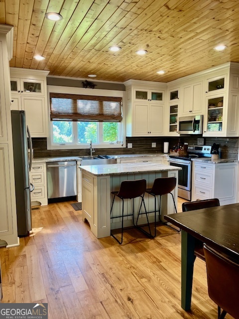135 Horseshoe Trail Commerce, GA 30529 - Photo 2 of 25 a kitchen with stainless steel appliances granite countertop a stove a sink dishwasher and a refrigerator