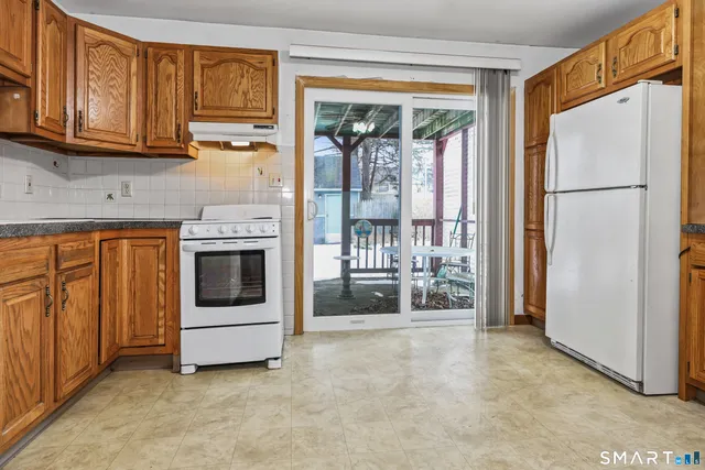 a kitchen with stainless steel appliances a refrigerator and cabinets