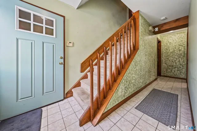 a view of a stairs and an entryway