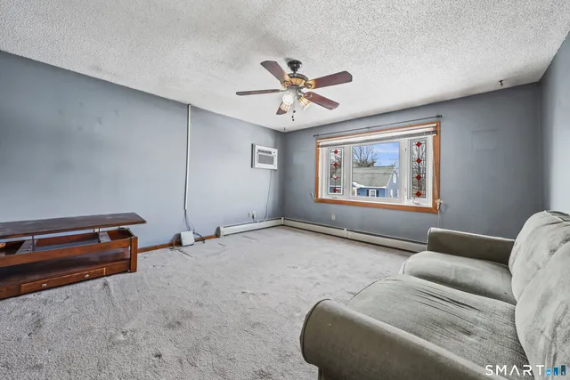 a living room with furniture and a window