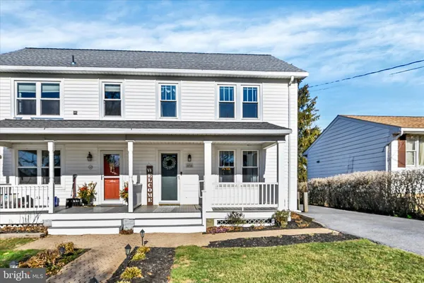 front view of a house with a small yard