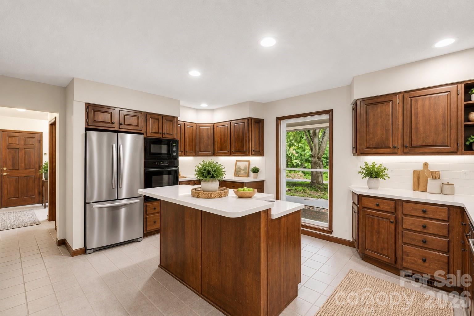 35 Byrd Road Candler, NC 28715 - Photo 13 of 43 a kitchen with refrigerator cabinets and wooden floor