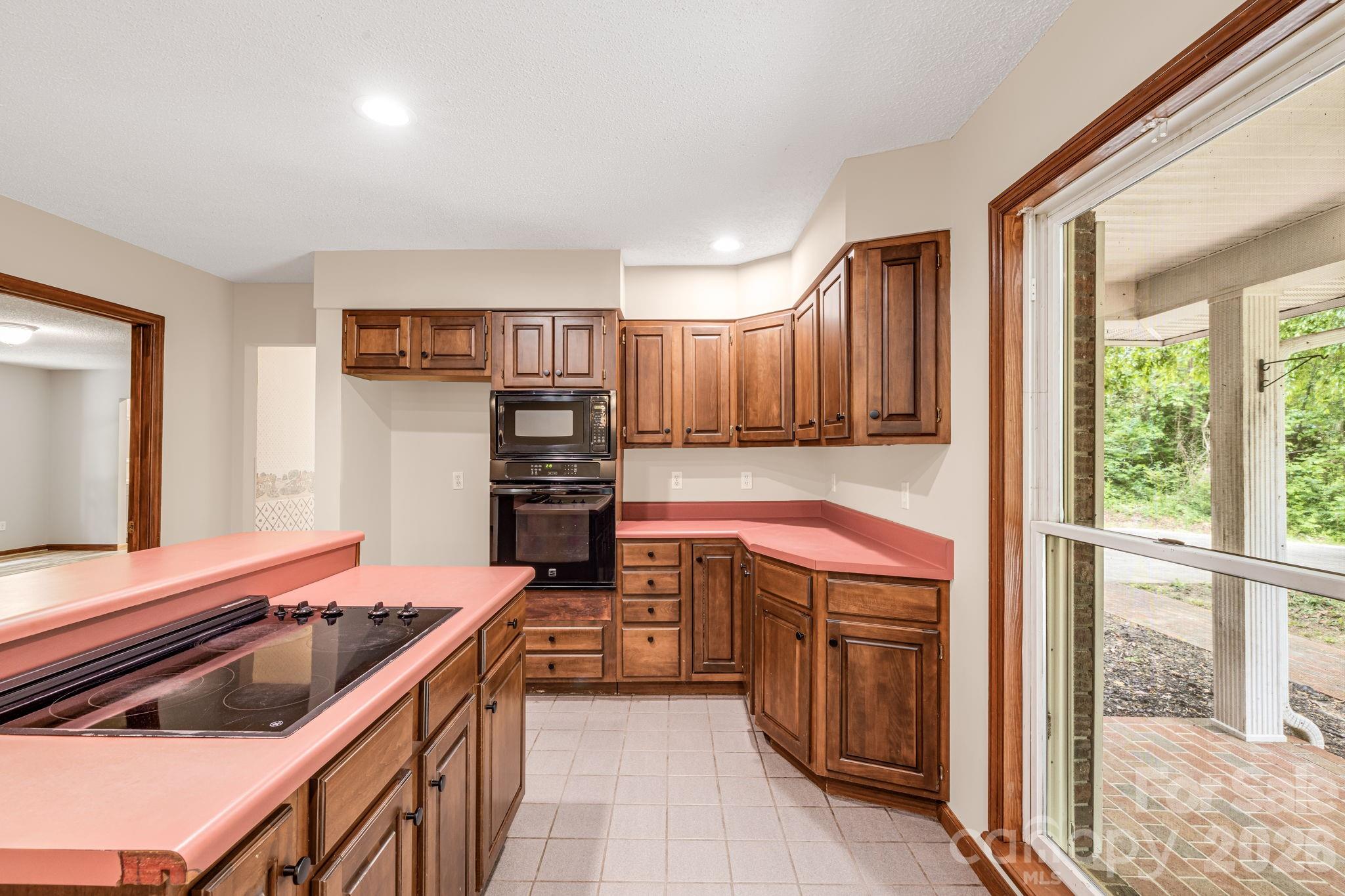 35 Byrd Road Candler, NC 28715 - Photo 14 of 43 a kitchen with stainless steel appliances granite countertop a stove and a refrigerator