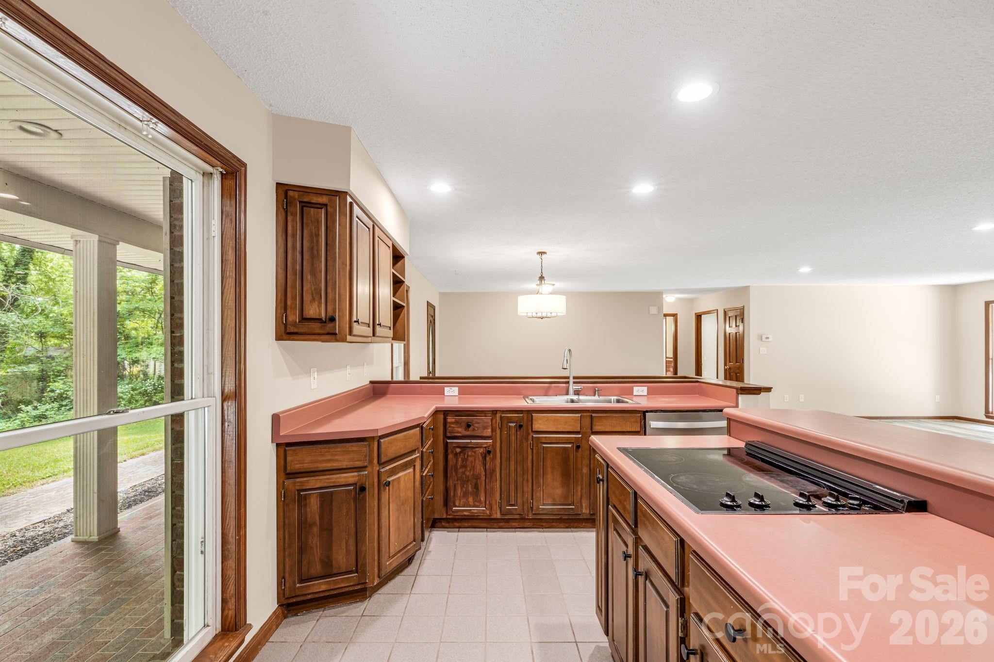 35 Byrd Road Candler, NC 28715 - Photo 17 of 43 a kitchen with stainless steel appliances granite countertop stove a sink and a refrigerator