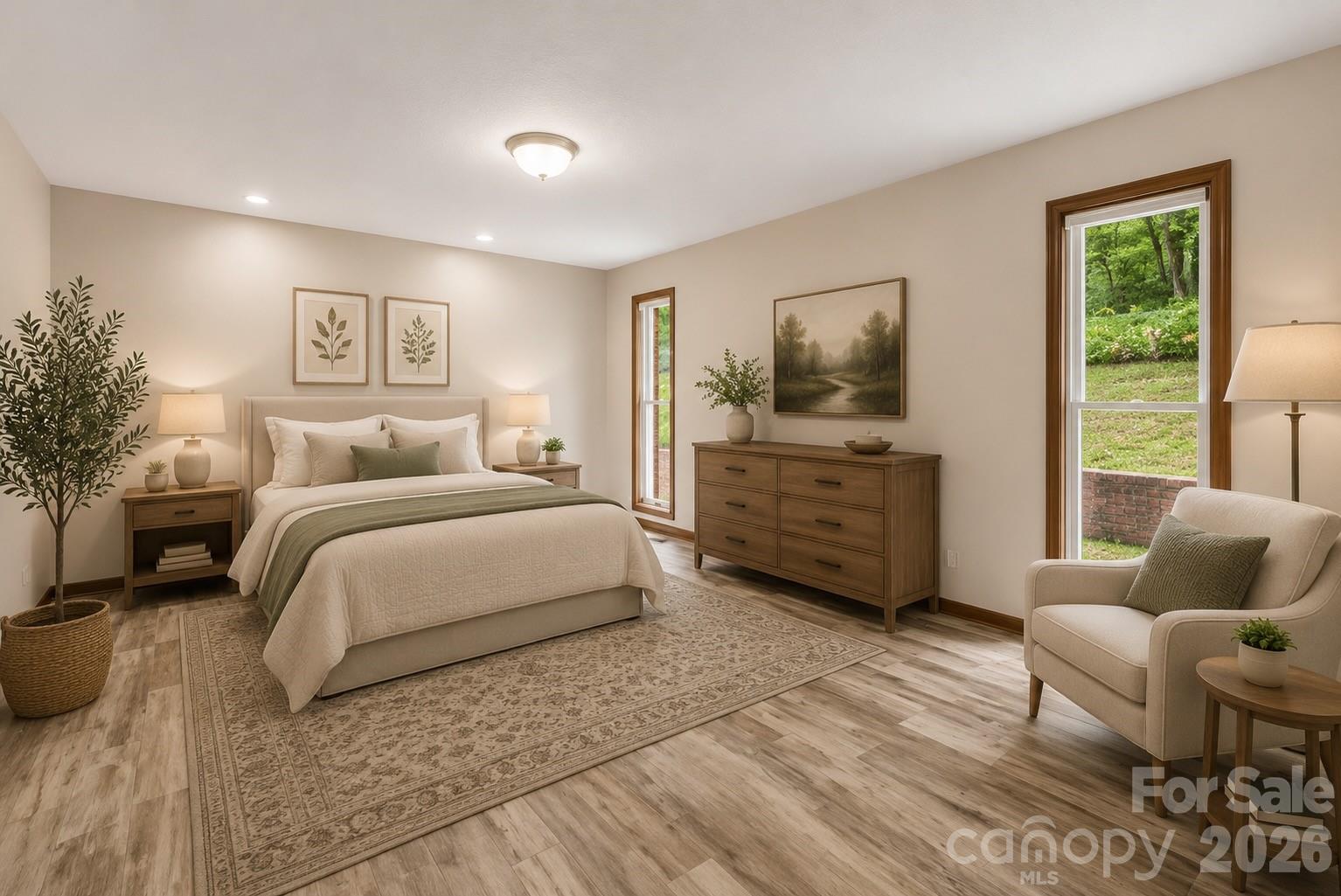 35 Byrd Road Candler, NC 28715 - Photo 26 of 43 a spacious bedroom with a bed a couch and a window