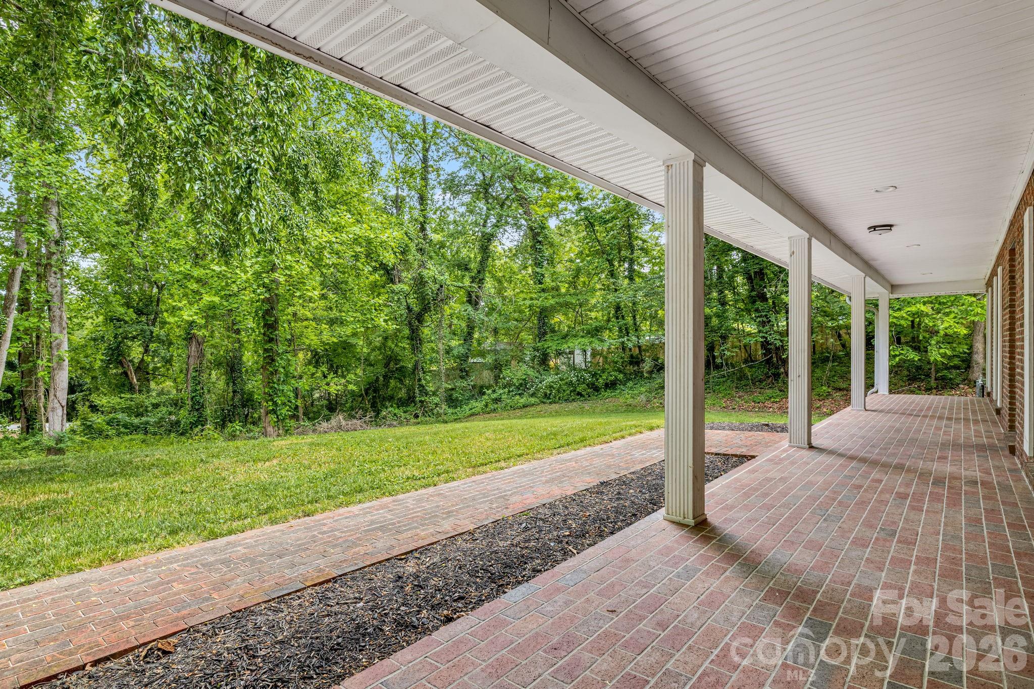 35 Byrd Road Candler, NC 28715 - Photo 3 of 43 a view of a room with a big yard and large tree