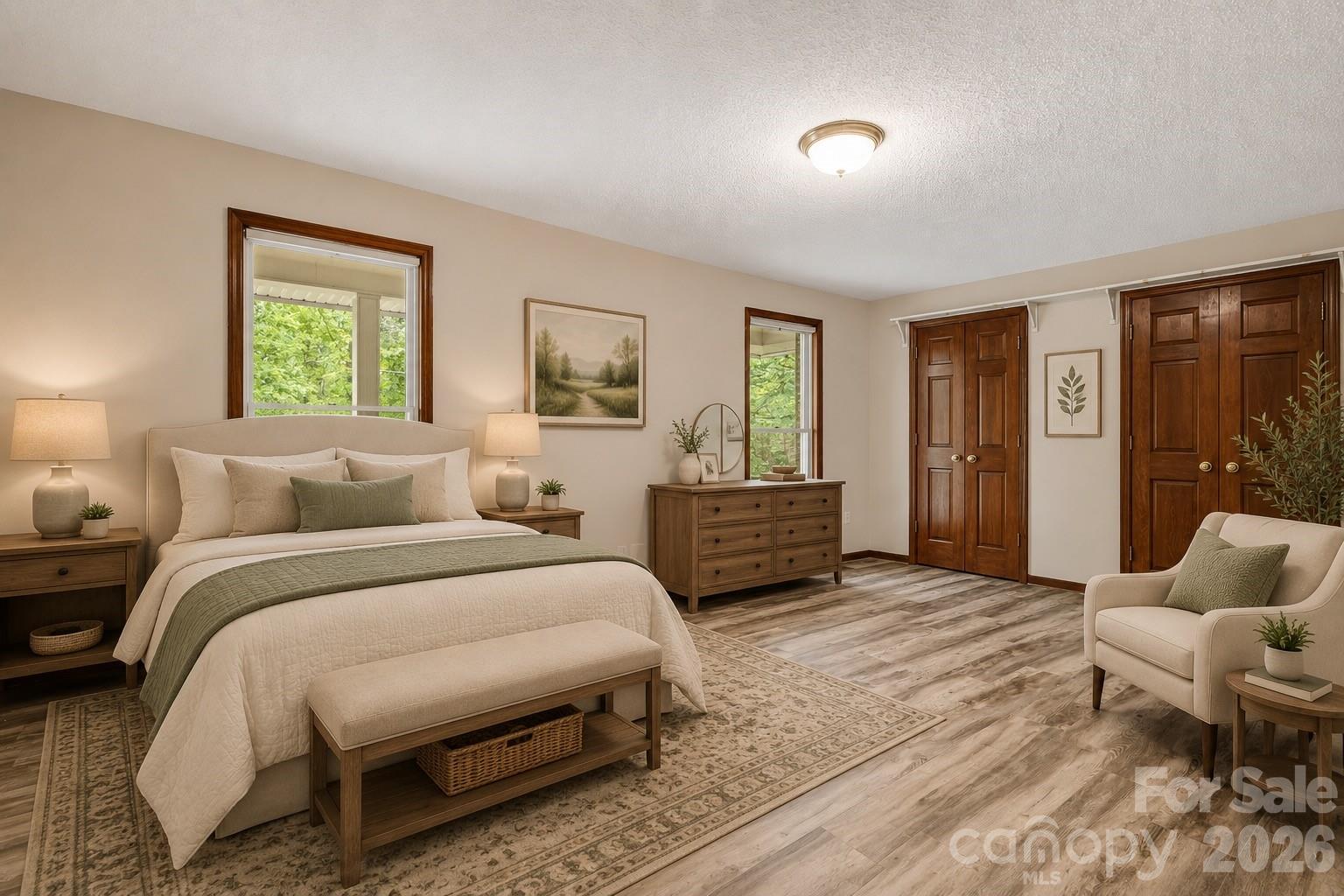 35 Byrd Road Candler, NC 28715 - Photo 33 of 43 a spacious bedroom with a bed and glass window