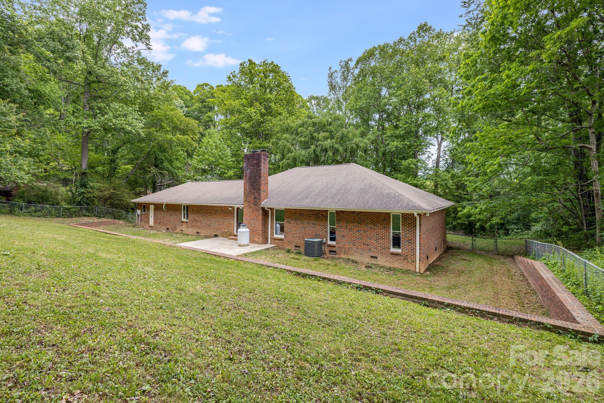 35 Byrd Road Candler, NC 28715 - Photo 36 of 43 a view of a house with backyard porch and garden