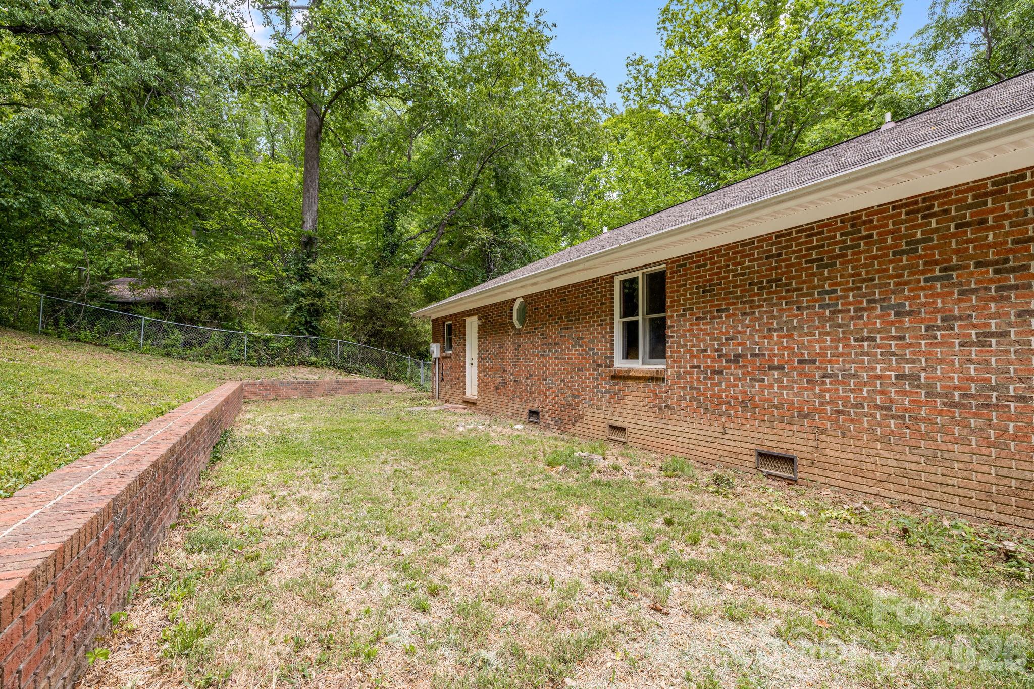 35 Byrd Road Candler, NC 28715 - Photo 39 of 43 a backyard of a house with seating space