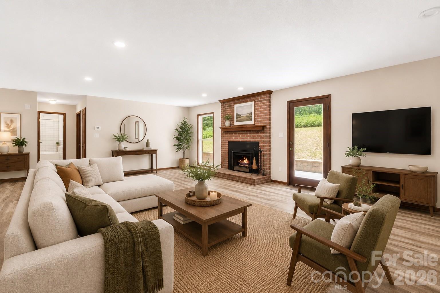 35 Byrd Road Candler, NC 28715 - Photo 8 of 43 a living room with furniture flat screen tv and a fireplace