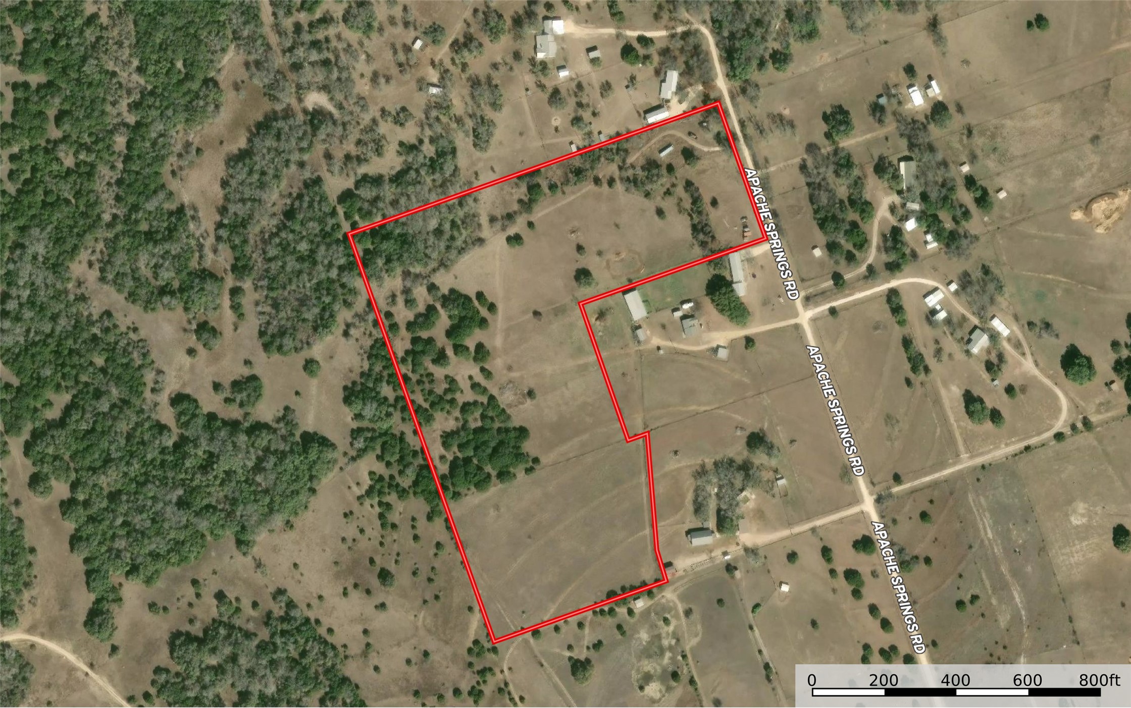 350 Apache Springs Road Briggs, TX 78608 - Photo 3 of 13 A spacious countryside lot framed by mature trees and adjacent to Apache Springs Road.