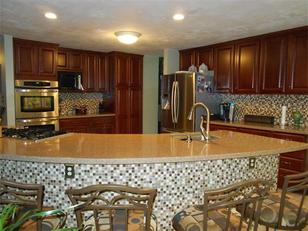 239 Monson Turnpike Road Ware, MA 01082 - Photo 1 of 30 a kitchen with granite countertop a sink and a stove top oven