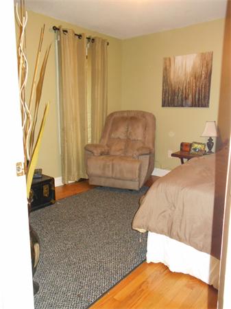 239 Monson Turnpike Road Ware, MA 01082 - Photo 20 of 30 a bedroom with a bed and a couch