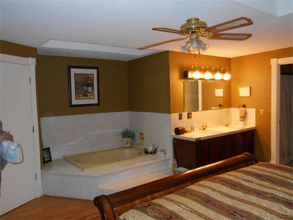 239 Monson Turnpike Road Ware, MA 01082 - Photo 22 of 30 a bathroom with a tub a sink and a shower