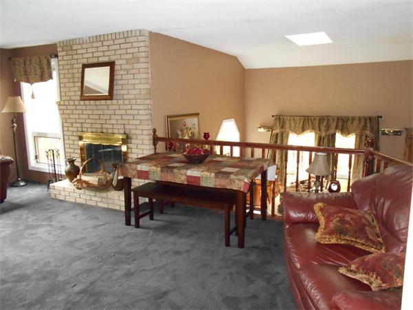 239 Monson Turnpike Road Ware, MA 01082 - Photo 7 of 30 a living room with furniture and a fireplace