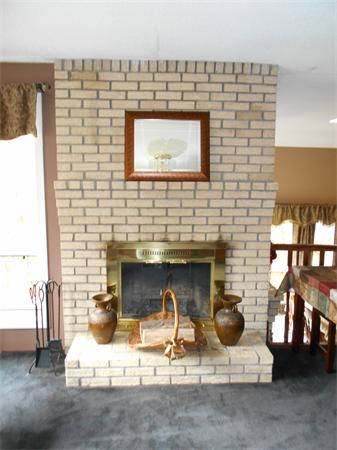 239 Monson Turnpike Road Ware, MA 01082 - Photo 8 of 30 a stone house with fireplace in front of it